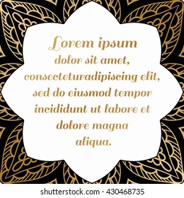 Decorative square element with a gold pattern on a black background.