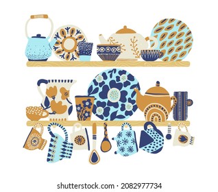 Decorative tableware shelves. Cute rustic ceramic dishes blue and beige colors, patterned cups, ornamental teapots and jug, retro faience goods, kitchen pottery