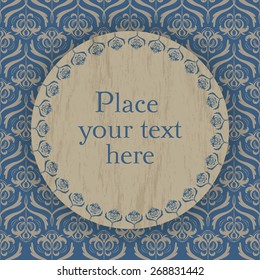 Decorative template in vintage style with a light gold romantic ornament drawn on a blue background and a wood circle with an old blue border and place for text