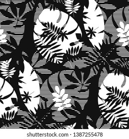 Decorative textured tropical leaves seamless pattern. Black and white foliage silhouette repeatable motif. Tile jungle element for fabric, wrapping paper, surface design.