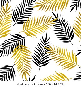 Decorative tropical seamless pattern with black and golden palm leaves on a white background