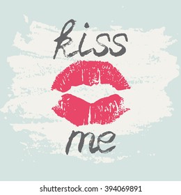 Decorative typography poster Kiss Me. Stylish grungy handwritten Black lettering and red lips imprint on light green messy shabby background. Modern print with hand drawn conceptual calligraphy