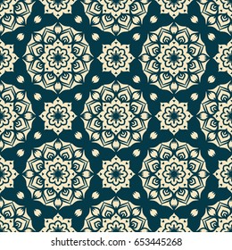 Decorative vector seamless pattern for design and print. Beige ornament with an abstract floral motive on a dark blue background