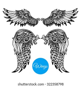 Decorative wings set with hand drawn ornamental feathers isolated vector illustration