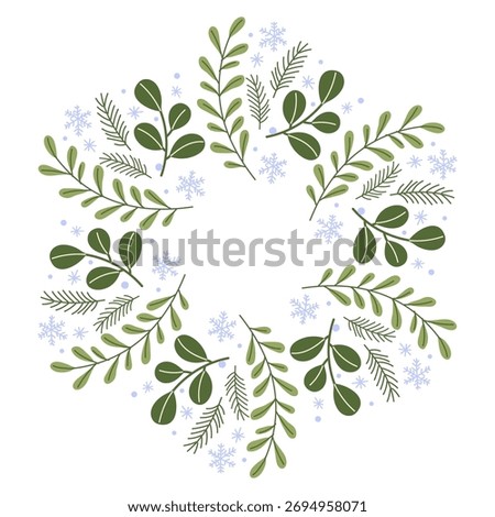 Decorative winter wreath made of green leaves and snowflakes in a circular design