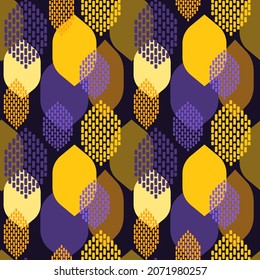Decorative yellow leaves on a dark purple background. Seamless modern pattern for textiles and paper products in flat design style. Vector.