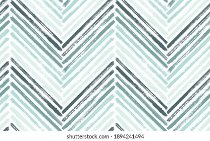 Decorative zig zag interior print vector seamless pattern. Paintbrush strokes geometric stripes. Hand drawn paint texture zig zag chevron backdrop. Watercolor fabric print seamless design.