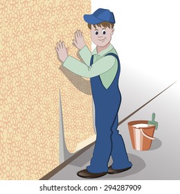The decorator or handyman glues wallpaper to wall