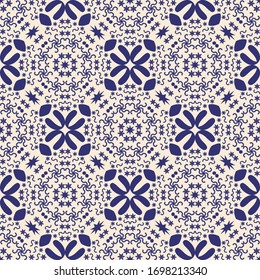 Deep blue color floral motif seamless pattern for tile, wallpaper, textile, bags and bedsheet. Geometric ethnic mandala texture on light background. 
