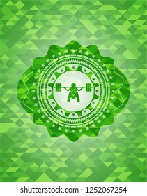 deep squat icon inside green emblem with triangle mosaic background