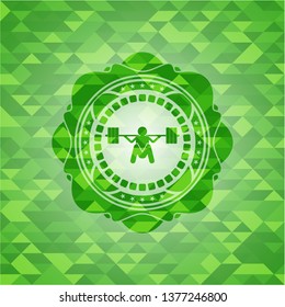 deep squat icon inside green emblem with triangle mosaic background