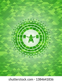 deep squat icon inside green mosaic emblem