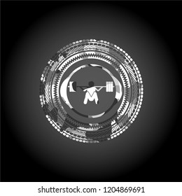 deep squat icon inside grey camo emblem