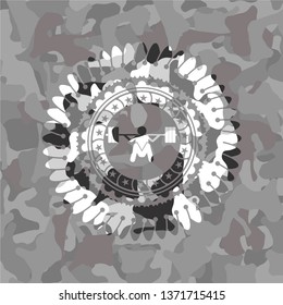 deep squat icon inside grey camouflage emblem