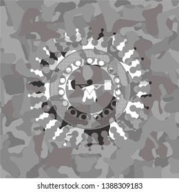 deep squat icon inside grey camouflaged emblem