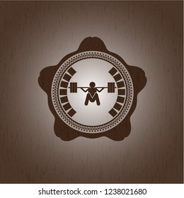 deep squat icon inside retro wooden emblem