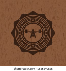 deep squat icon inside retro style wooden emblem. 