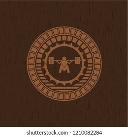 deep squat icon inside vintage wood emblem