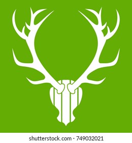 Deer antler icon white isolated on green background. Vector illustration