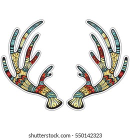Deer antlers with native ornament