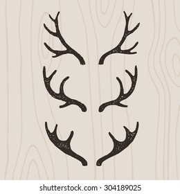 Deer Antlers Set On Wood Background Stock Vector (Royalty Free ...