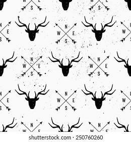 Deer head and arrows seamless pattern in black and white.