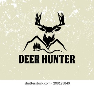 deer head and mountains on grunge background