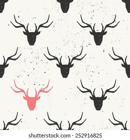 Deer head silhouette seamless pattern in black and pink.