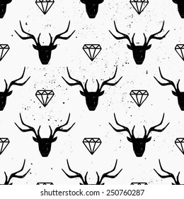 Deer heads and diamonds seamless pattern in black and white.