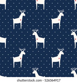 Deer with heart seamless pattern on polka dots blue background. Xmas animal background. Child drawing style animal illustration. Cute holidays design for textile, wallpaper, fabric.