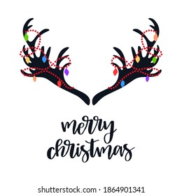 Deer horns with decorative garlands and text Merry Christmas. Holiday vector design.