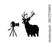 Deer with large antlers looking at camera