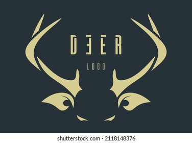 Deer logo concept design. Golden stylized deer head on a dark green background. Deer lettering. Vector illustration