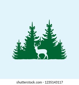 Deer on the background of the coniferous forest. 