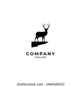 deer on rock logo hipster retro vintage vector icon illustration