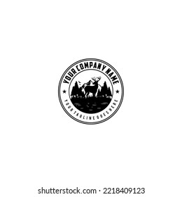 Deer silhouette in mountain landscape with trees and water black and white circular emblem