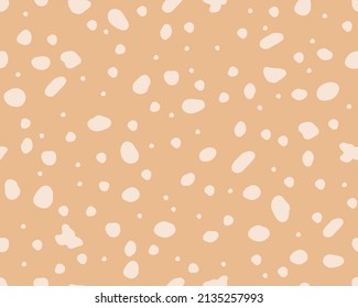  La textura de piel de ciervo es un patrón sin fisuras. Perfecto para el tejido, papel pintado y decoración casera. Fondo abstracto con puntos. Fondo del vector sobre la superficie beige