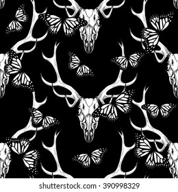 Deer skull and  butterfly on black background .  Vector seamless pattern