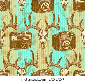 Deer skull and retro photo camera, hipster sketch pattern