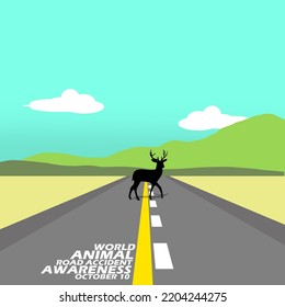 A Deer Standing In The Middle Of The Road With A Mountain View In A Cloudy Blue Sky And Bold Text To Observe Animal Road Accident Awareness Day On October 10