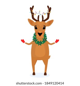 A deer with a wreath of spruce branches and mistletoe around the neck and a Christmas garland on the horns