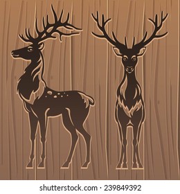 Deers on wood background