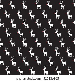 Deers with red noses on black background. New Year and Merry Christmas seamless vector pattern with rein deers in hipster style.