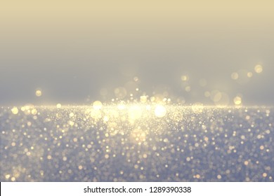 Defocused glitter dust effect. Sparkling golden particles abstract luxury background