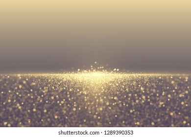 Defocused glitter dust effect. Sparkling golden particles abstract luxury background