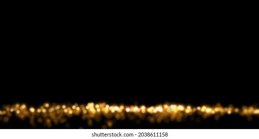Defocused glitter texture. Abstract luxury background with golden particle dust. Shiny glittering lights on black.