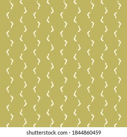 Deformed and broken zigzags drawn in white on a golden beige background. Wallpaper texture. Wrapping paper.