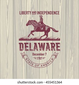 Delaware Liberty and Independence, stylized emblem of the state of America, horse, rider, on wooden background