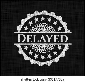 Delayed chalkboard emblem written on a blackboard