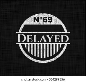 Delayed chalkboard emblem written on a blackboard